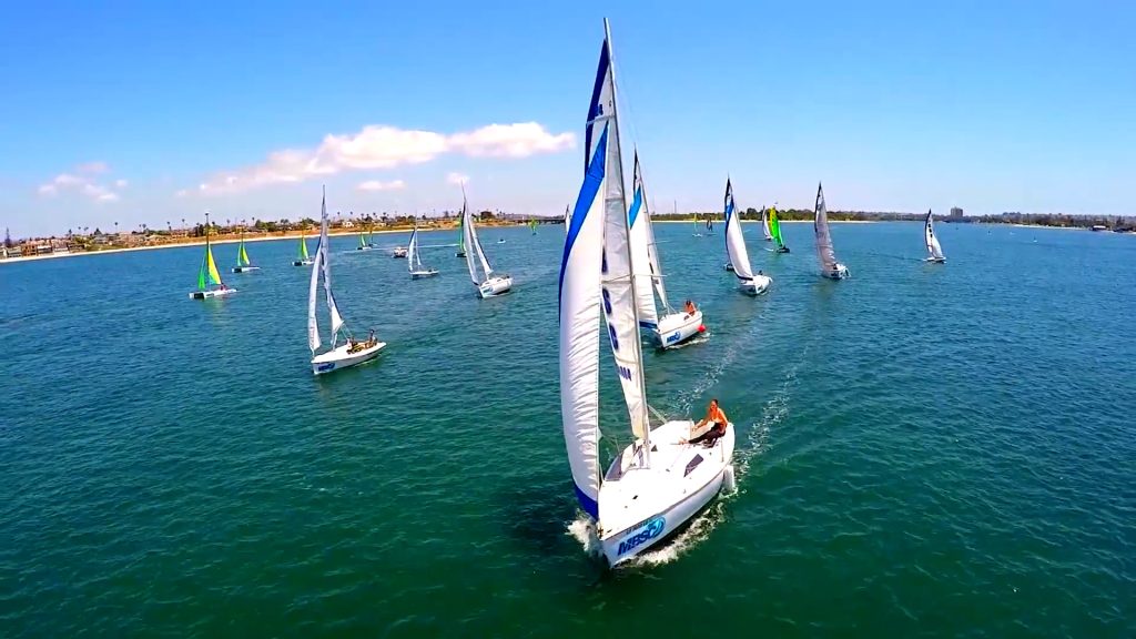 A fleet of sailboats and catamarans enjoying Mission Bay