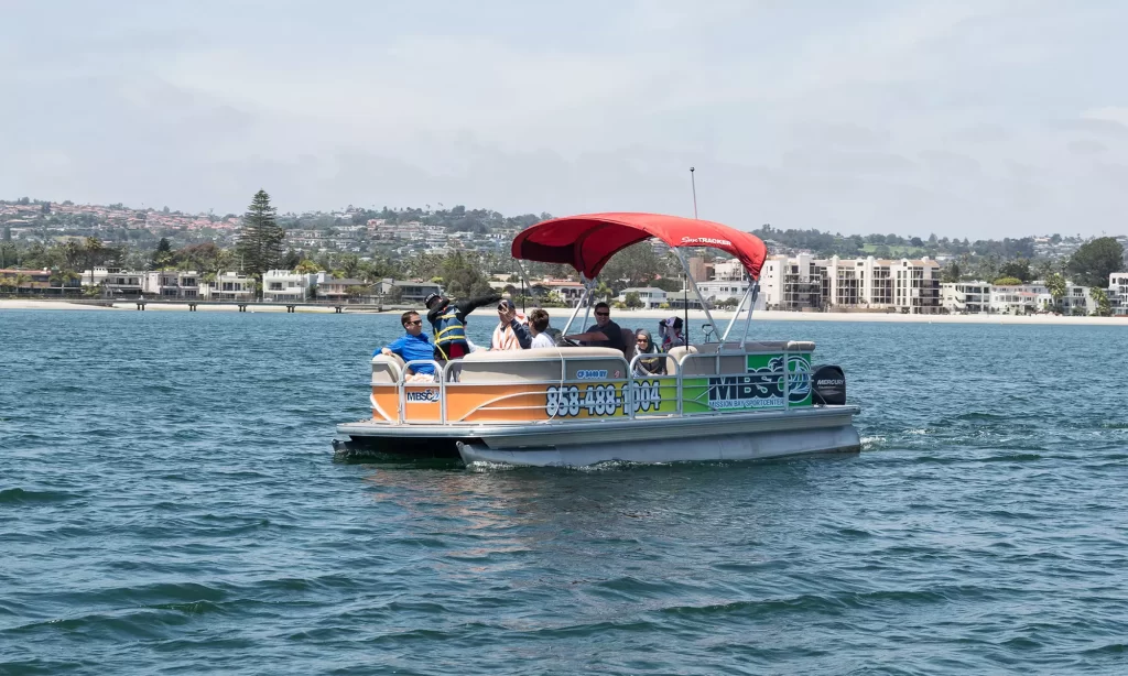 A group cruising Mission Bay together on a Mission Bay Sportcenter pontoon boat