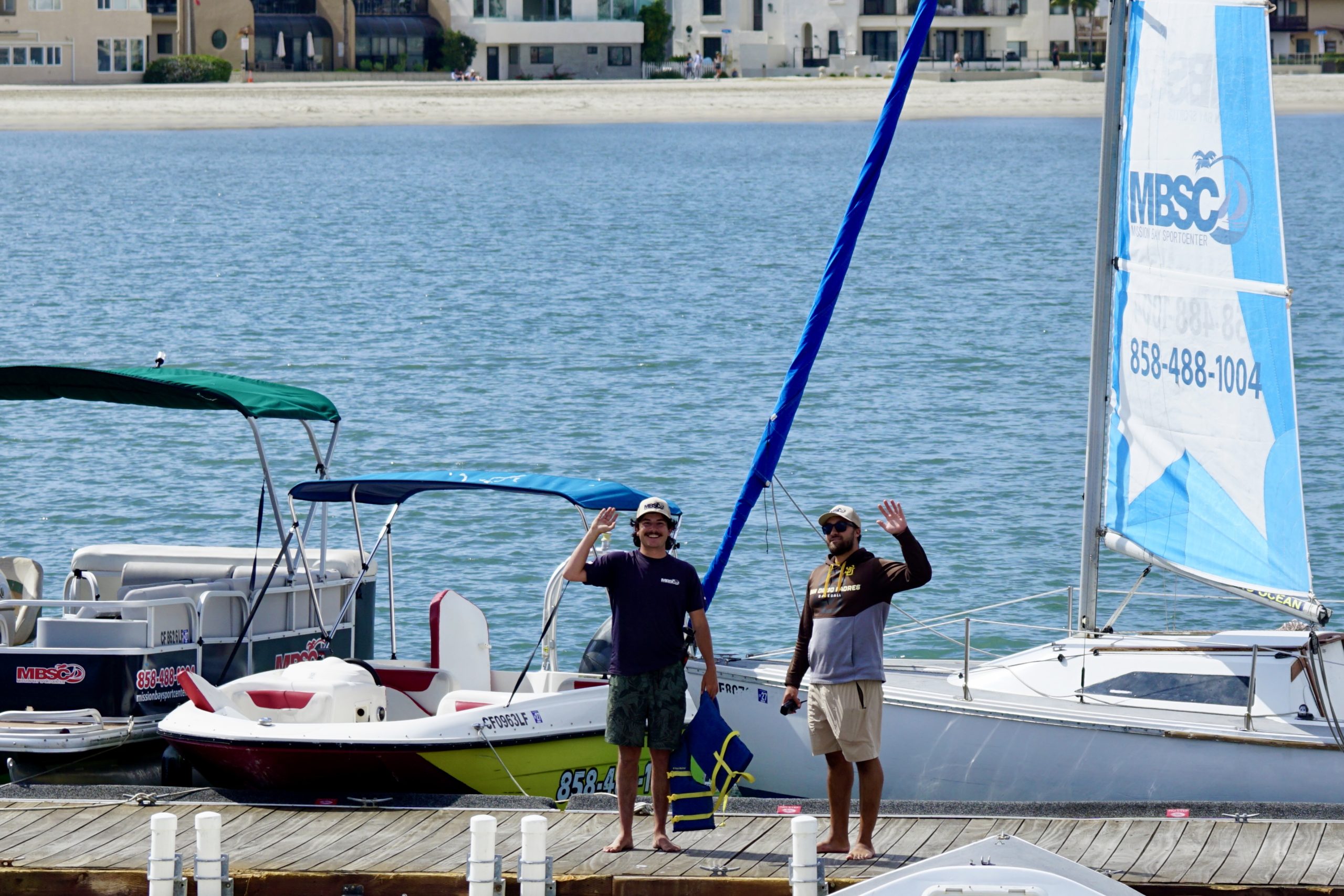Mission Bay Sportcenter dock attendants helping guests before launching on Mission Bay