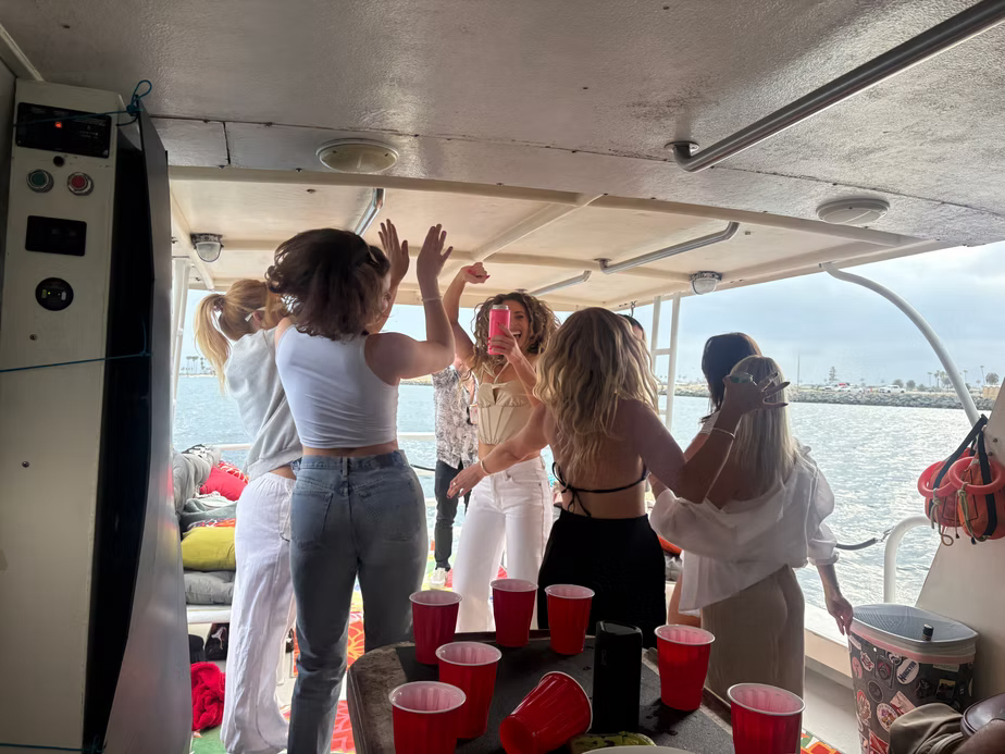 Girls dancing on Marissa party boat in Mission Bay