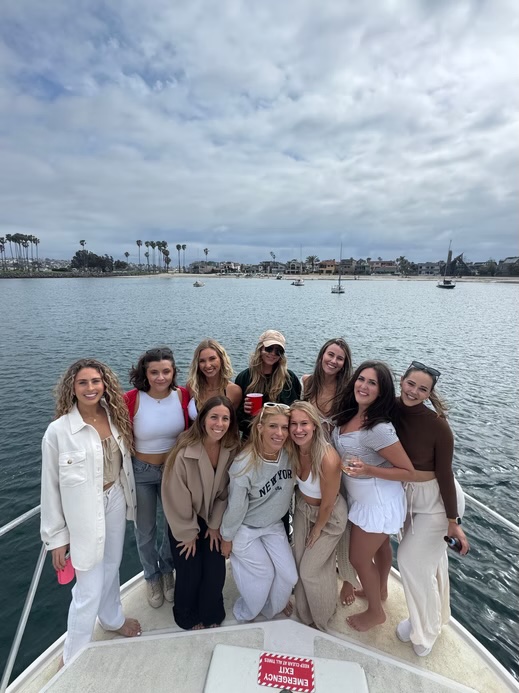Group of girls posing on Marissa bachelorette party boat in San Diego