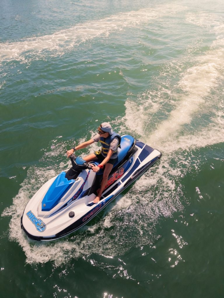 Two guests riding a Yamaha WaveRunner together on Mission Bay